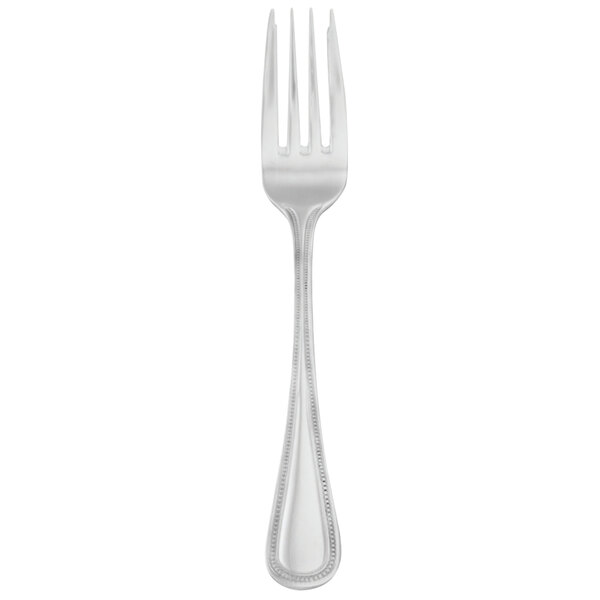A silver Walco Classic Bead salad fork with a white handle.