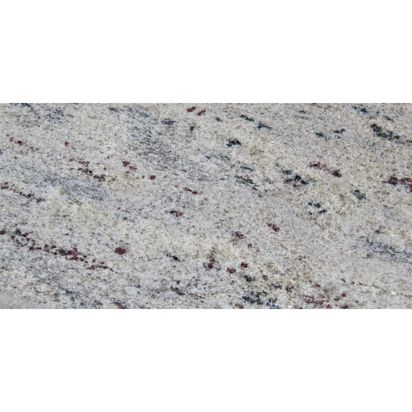 A close-up of a white and black granite Art Marble Furniture tabletop.