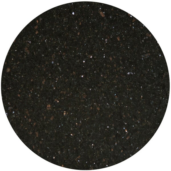 A black speckled surface with white specks.