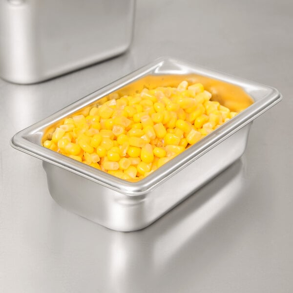 A Vollrath stainless steel steam table pan with corn in it.