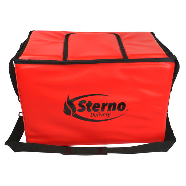 A red Sterno insulated food carrier bag with black trim and straps.