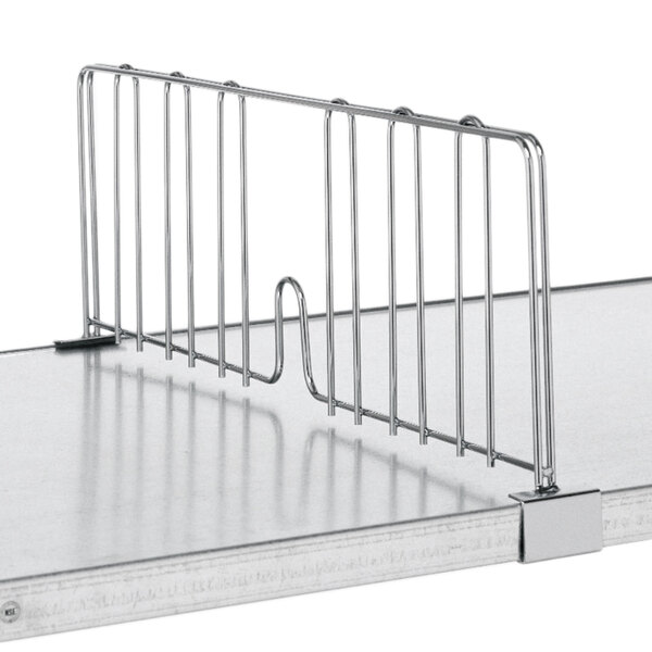 A Metro stainless steel shelf with a solid metal rack on top.