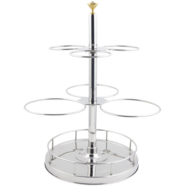 A silver metal Bon Chef revolving condiment holder with four rings on it holding six round containers.