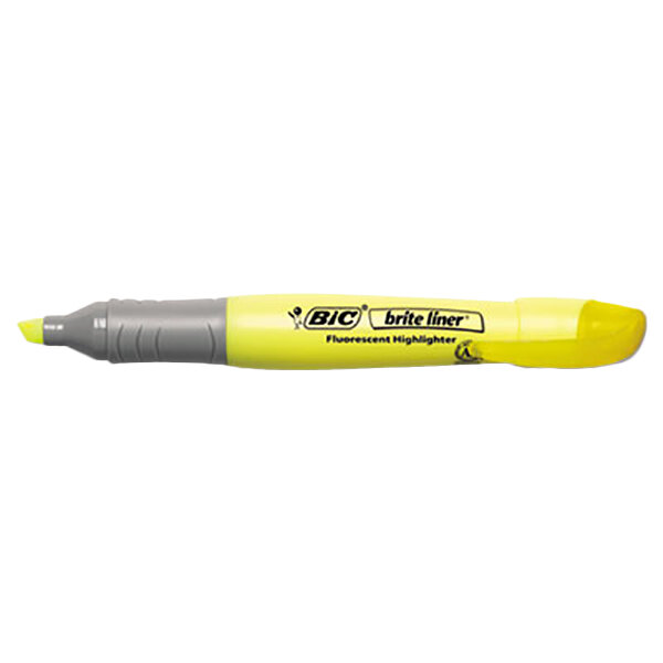 A Bic yellow highlighter pen with a chisel tip.