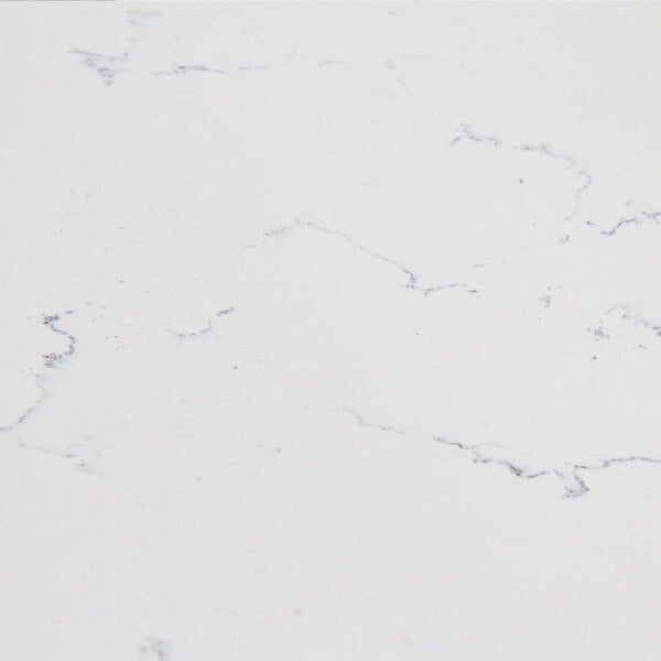 A close up of an Art Marble Carrera White Quartz Tabletop with black lines.