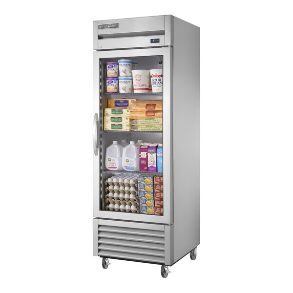 A True reach-in refrigerator with glass doors full of dairy products.