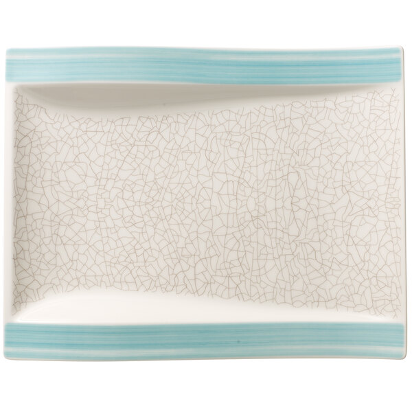 A white rectangular porcelain plate with a blue crackled design.
