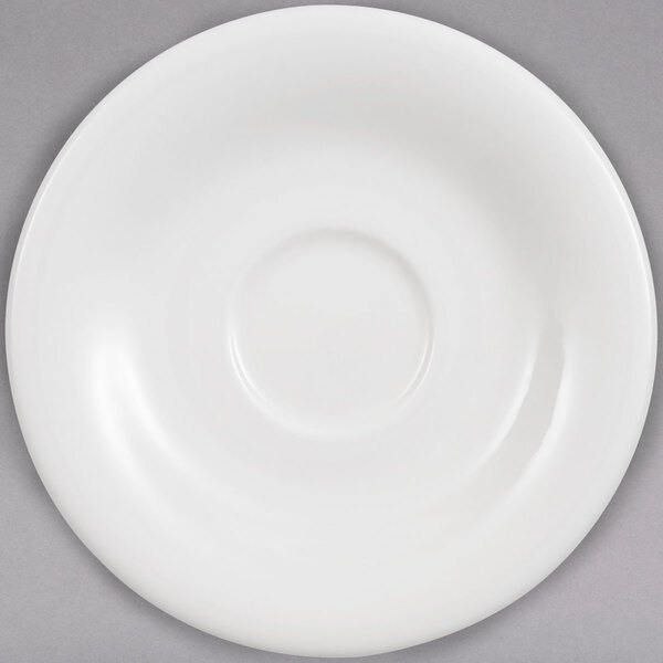 A white Villeroy & Boch Dune saucer with a rim.