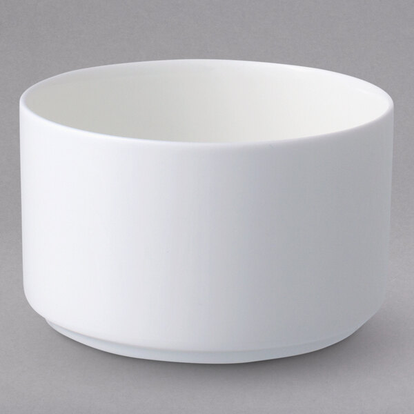 A Villeroy & Boch white bone porcelain bouillon cup with a white rim on a gray background.