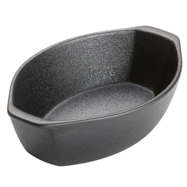 An American Metalcraft black matte porcelain oval casserole dish with handles.