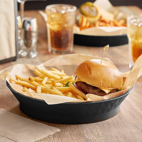 A black plastic platter with a Choice cheeseburger and fries in a basket.