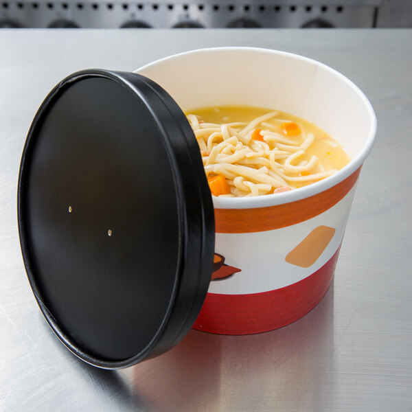 A Choice paper soup cup with a vented paper lid full of noodle soup.