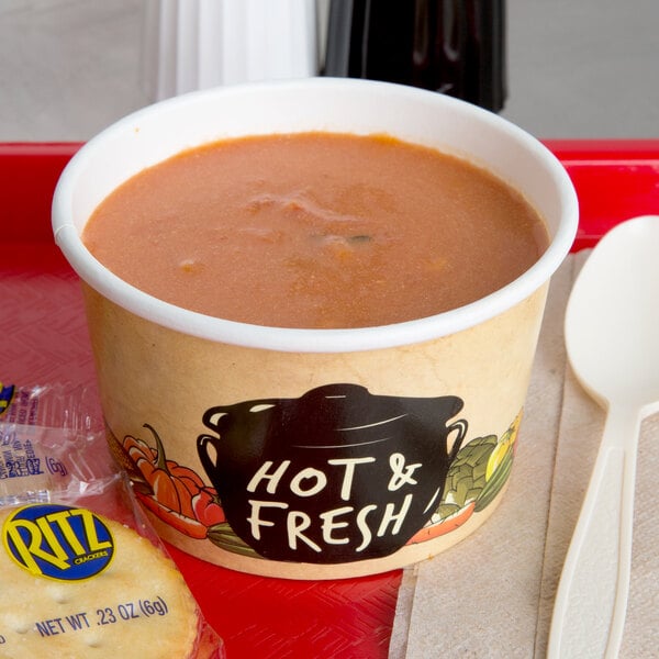 A tray with a bowl of soup and a Choice paper soup cup on it.