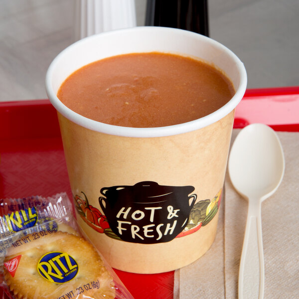 A tray with a Choice paper soup cup filled with soup and a spoon.