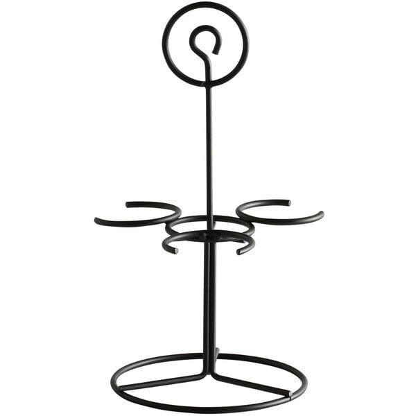 A black metal stand with three round rings.