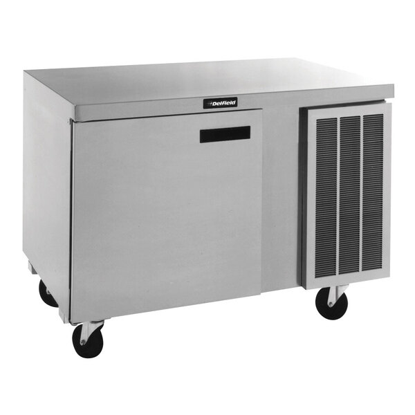 A Delfield stainless steel undercounter refrigerator with a door on wheels.
