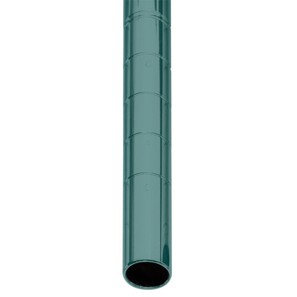 A green Metroseal 3 Metro Super Erecta post with a black circle on a white surface.