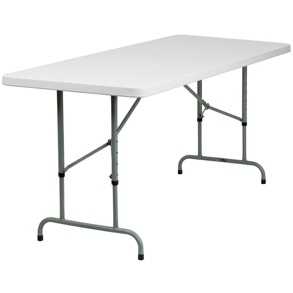 A Flash Furniture white rectangular folding table with metal legs.