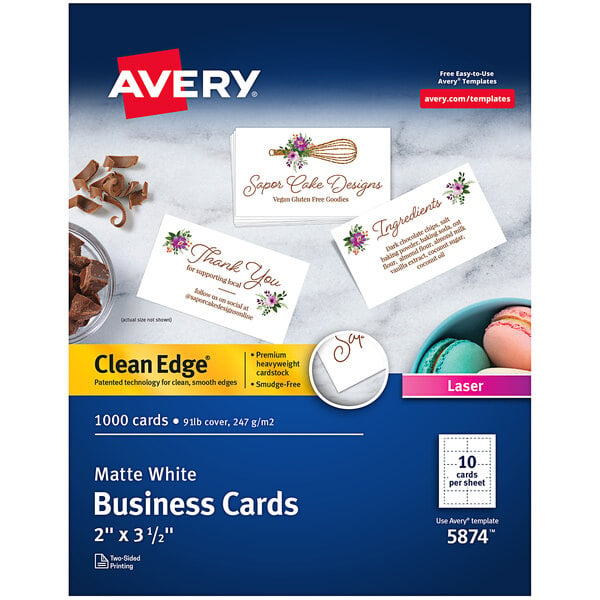 A box of uncoated white Avery business cards with brown writing on them.