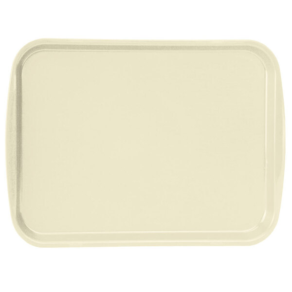 A beige rectangular Vollrath plastic tray with built-in handles.