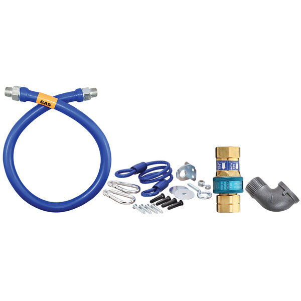 A blue Dormont gas connector kit with hose and parts.