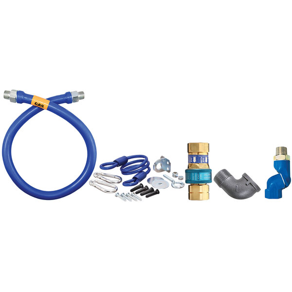 A blue Dormont gas connector kit with fittings and a restraining cable.