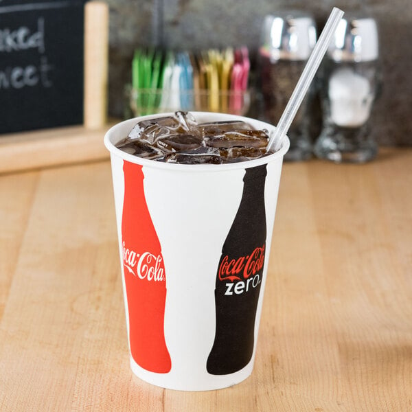 A Solo paper cold cup with a Coke logo, filled with ice and soda with a straw.