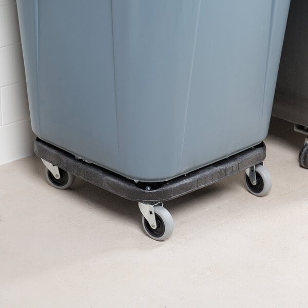 A gray Rubbermaid trash can dolly with wheels.