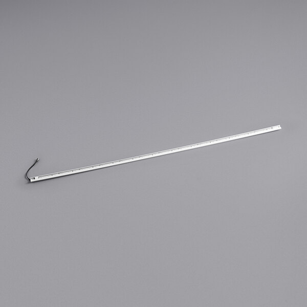 A white metal rod with a long white ruler on a gray background.