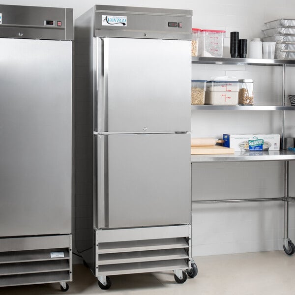 Two Avantco stainless steel half door reach-in refrigerators in a kitchen.