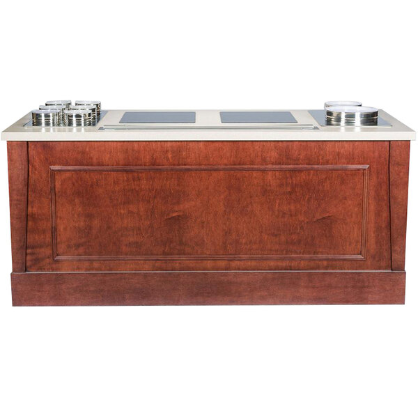 A wood buffet with two induction ranges on a wooden counter.