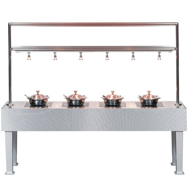 A Bon Chef stainless steel table with 4 induction warmers holding pots.