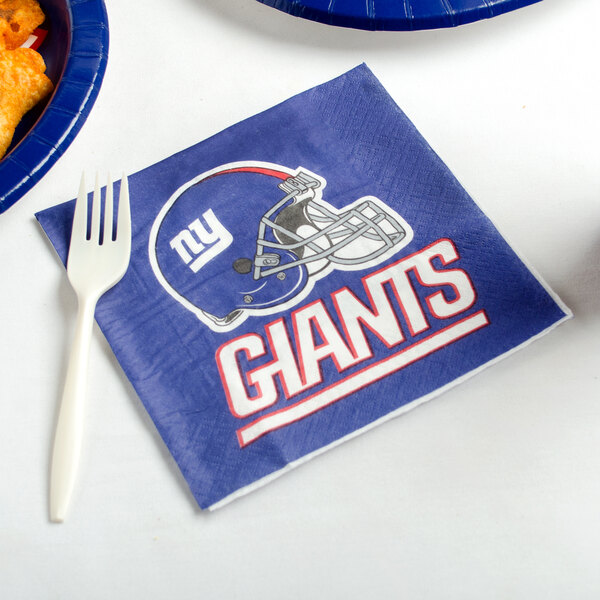 A blue New York Giants luncheon napkin with a football helmet on it.