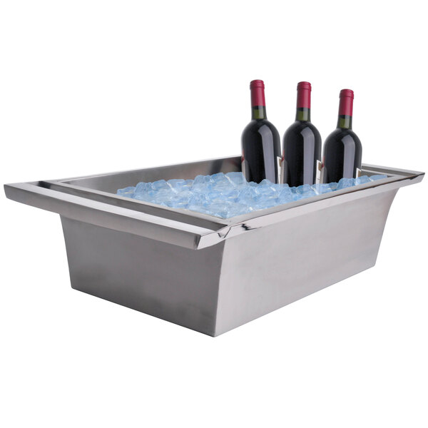 A stainless steel Clipper Mill beverage tub filled with ice and bottles of wine.