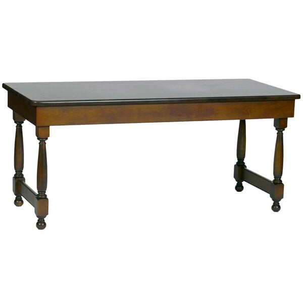 A brown wooden Bon Chef rectangular tavern table with black legs.