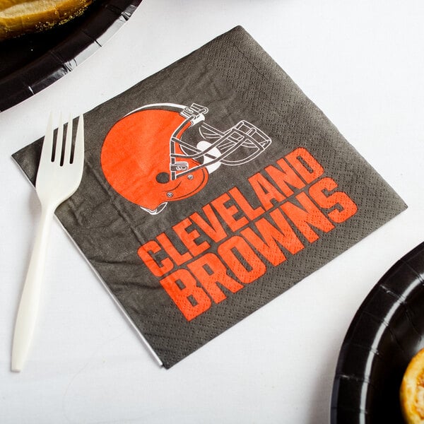 A Cleveland Browns luncheon napkin on a counter.