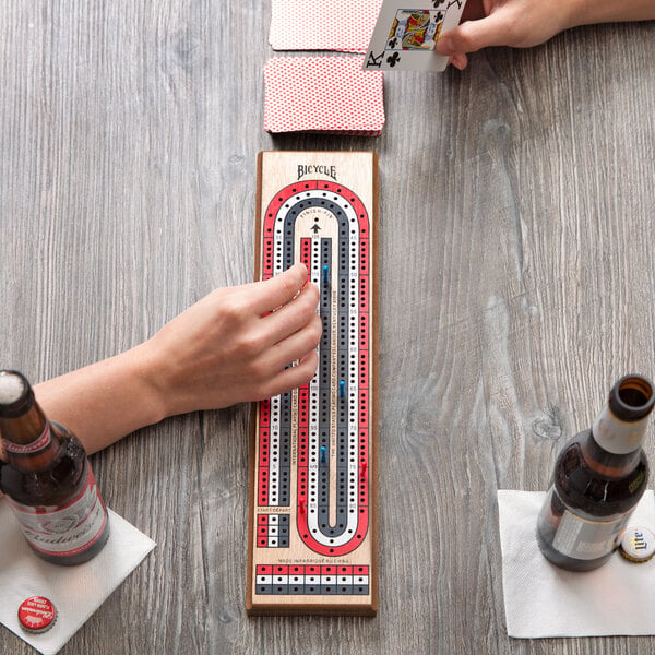 A person playing Bicycle 3-Track Cribbage.
