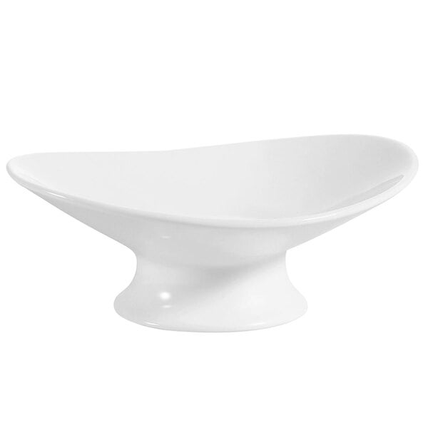 A CAC bone white oval porcelain plate with a small pedestal.