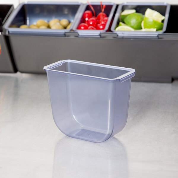 A San Jamar plastic container with a lid and a tray on a white surface.