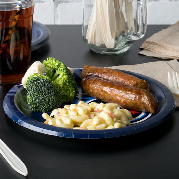 A Creative Converting Tennessee Titans paper dinner plate with macaroni and cheese, broccoli, and sausage on a table.