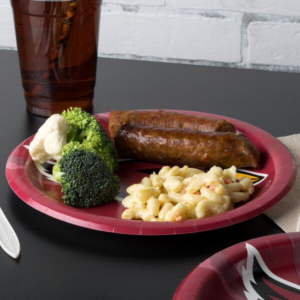 A plate of food including broccoli on a Creative Converting Arizona Cardinals paper dinner plate.