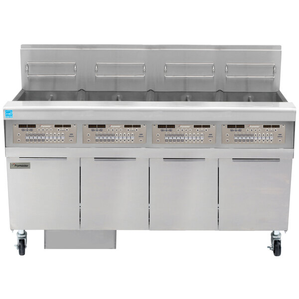 A Frymaster gas floor fryer system with four stainless steel trays and a control panel.