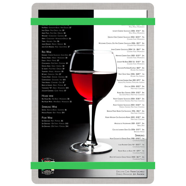 A Menu Solutions Alumitique menu board with green bands displayed on a table with a glass of wine.