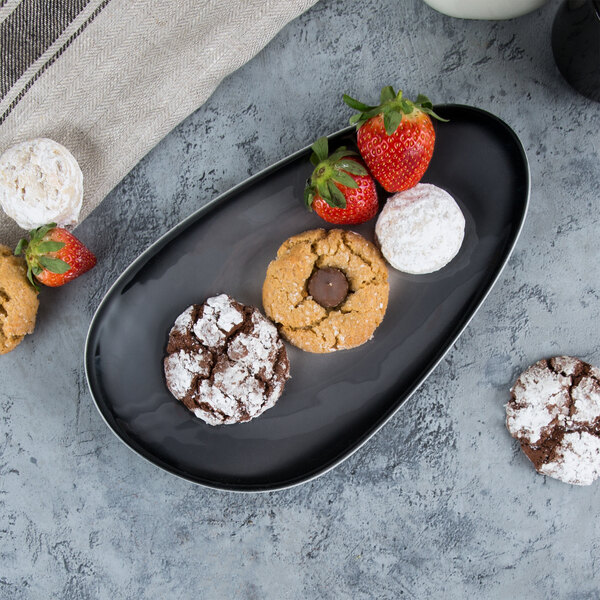 A Reserve by Libbey Pebblebrook obsidian porcelain tray with cookies and strawberries.