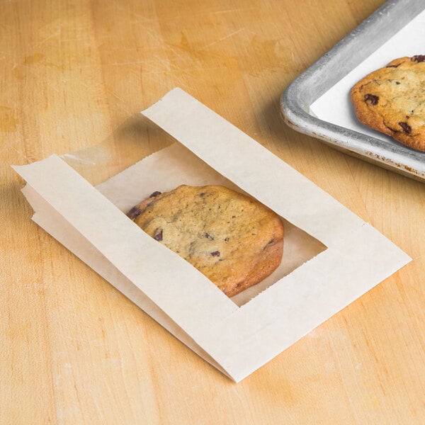 A cookie in a Bagcraft Packaging paper wrapper with a window.