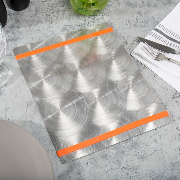 A silver Menu Solutions aluminum menu board with orange bands on a white surface with silverware.