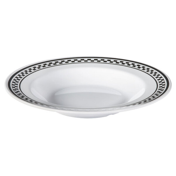 A white melamine bowl with black and white diamond patterned rim.