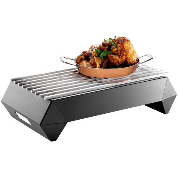 A pan of food on a Rosseto stainless steel grill top.