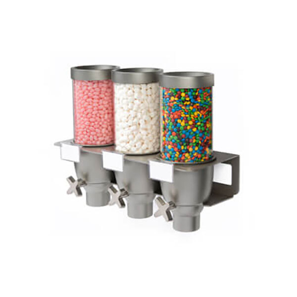 A white wall-mounted Rosseto triple dispenser with candy and sprinkles inside.