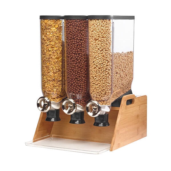 A Rosseto triple cereal dispenser on a counter filled with cereals and nuts.